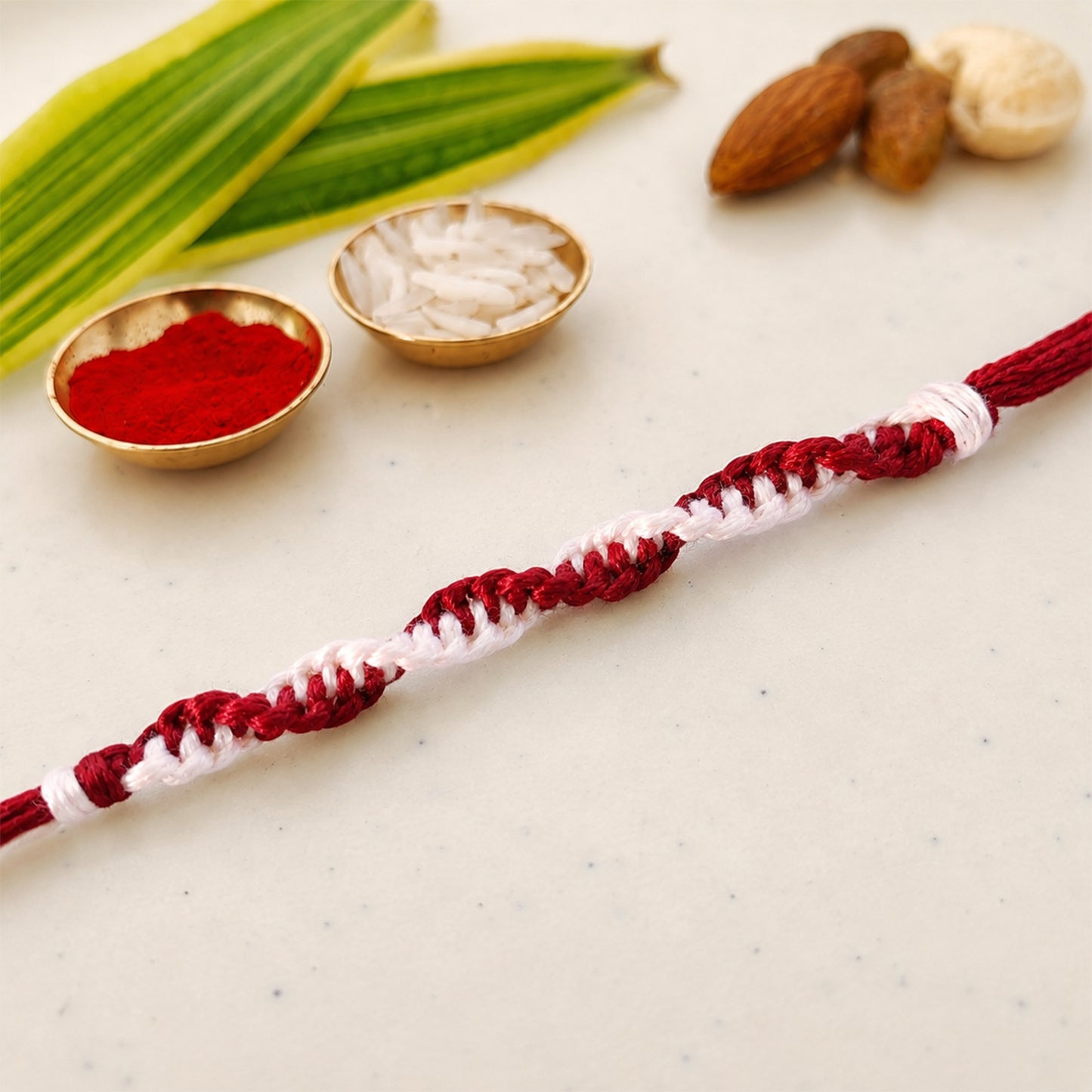 Maroon-White Twisted Cord Rakhi with Simple Beadless Design