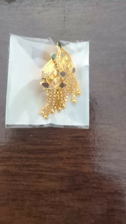 Pair of gold-plated jhumka earrings styled for traditional Indian attire