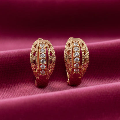 Gold finish CZ studded hoop earrings showing elegant subtle shine