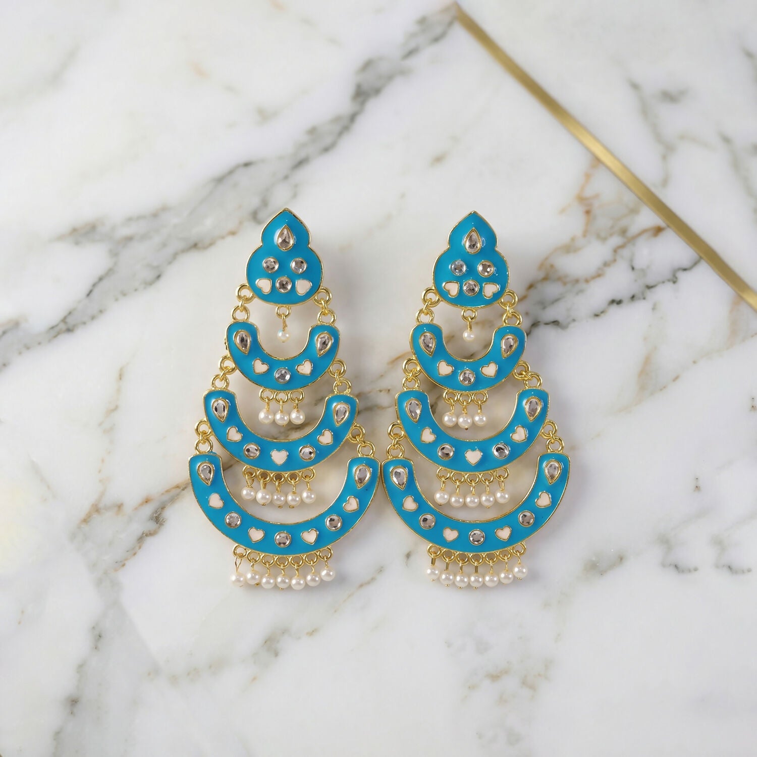 Full view of sky blue layered chandbali earrings with pearls