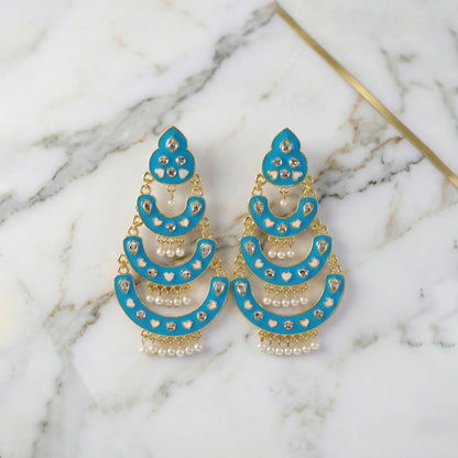 Full view of sky blue layered chandbali earrings with pearls