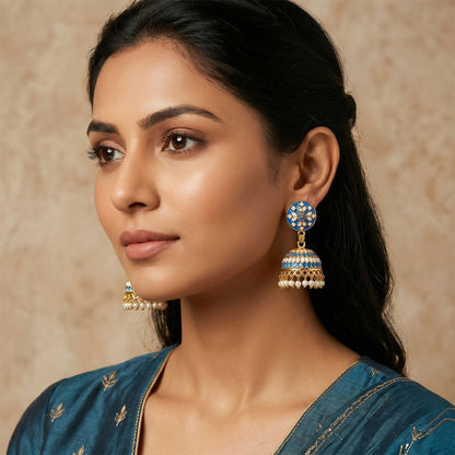 Close-up of decorative dome design on blue jhumka earrings