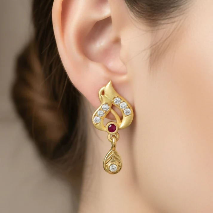Classic Gold Tone Designer Leaf Earrings With Ruby Accent And Graceful Hanging Drop