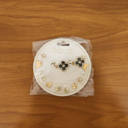 Fashion earrings gift set showing floral, bow, pearl, and stud earrings in gold and black combo