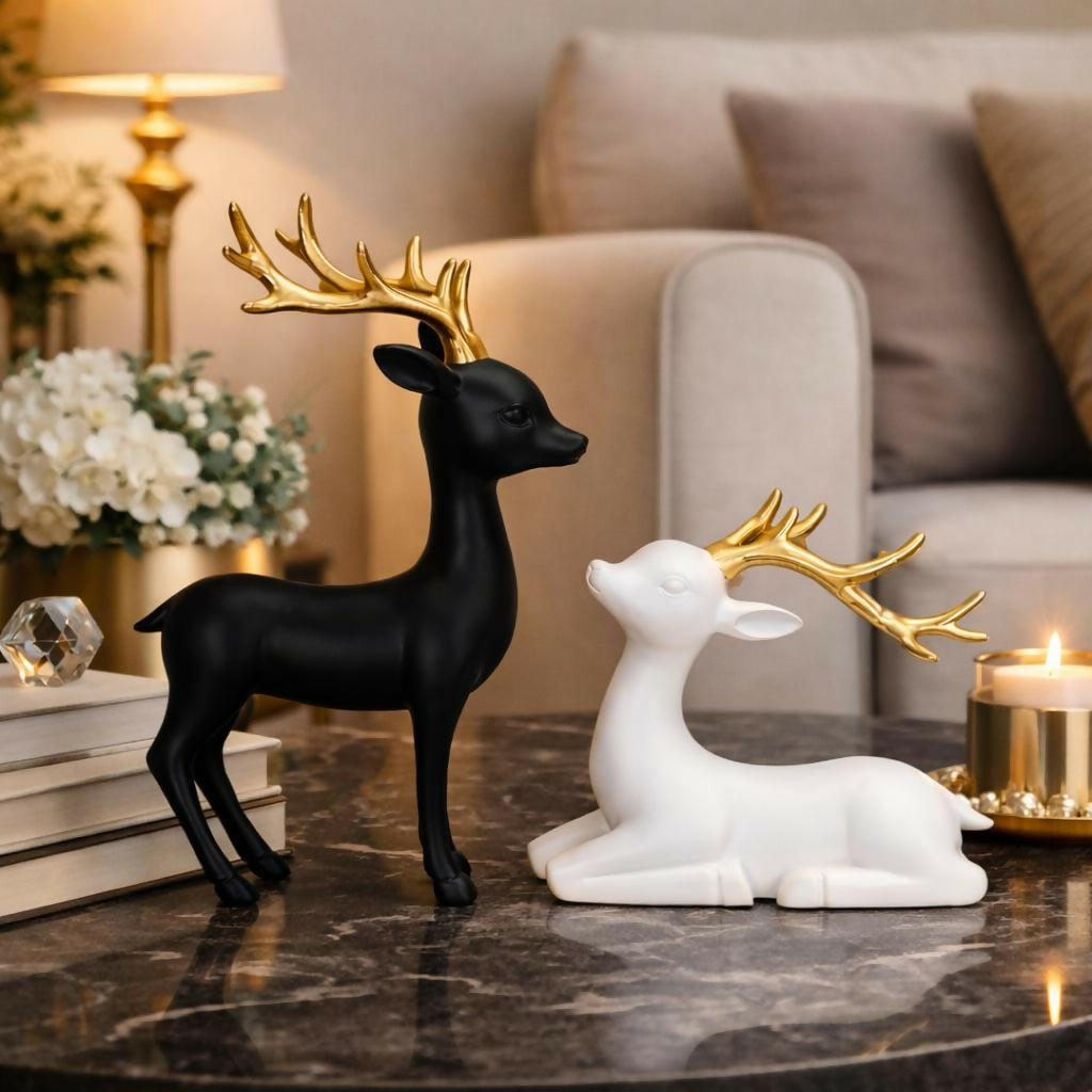 Close-up of golden antlers on black and white deer figurine