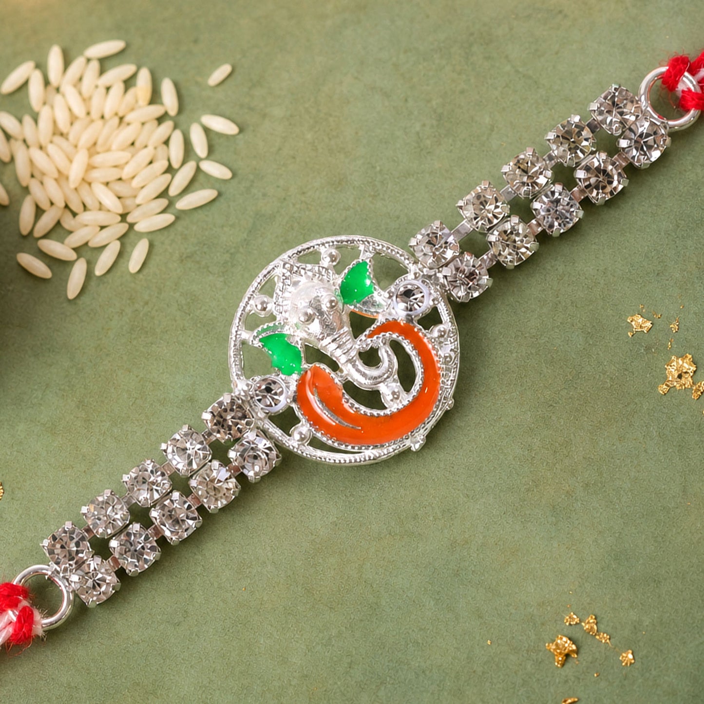 Silver-Toned Lord Ganesha Rakhi with Orange-Green Enamel, Double Crystal Chain & Red-White Thread