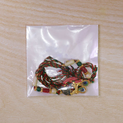 Peacock Rakhi Set with Red Thread, Gold Beads and Meenakari Accent Design
