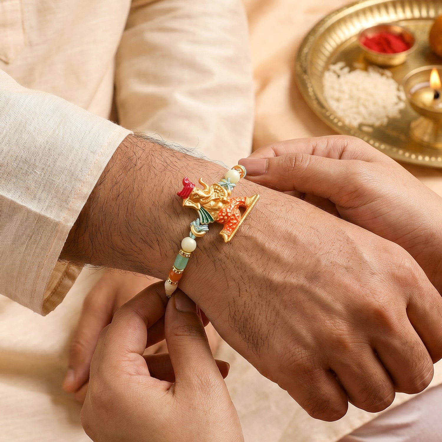 Colorful Ganesh Rakhi for Boys with Beads and Red-Blue Thread