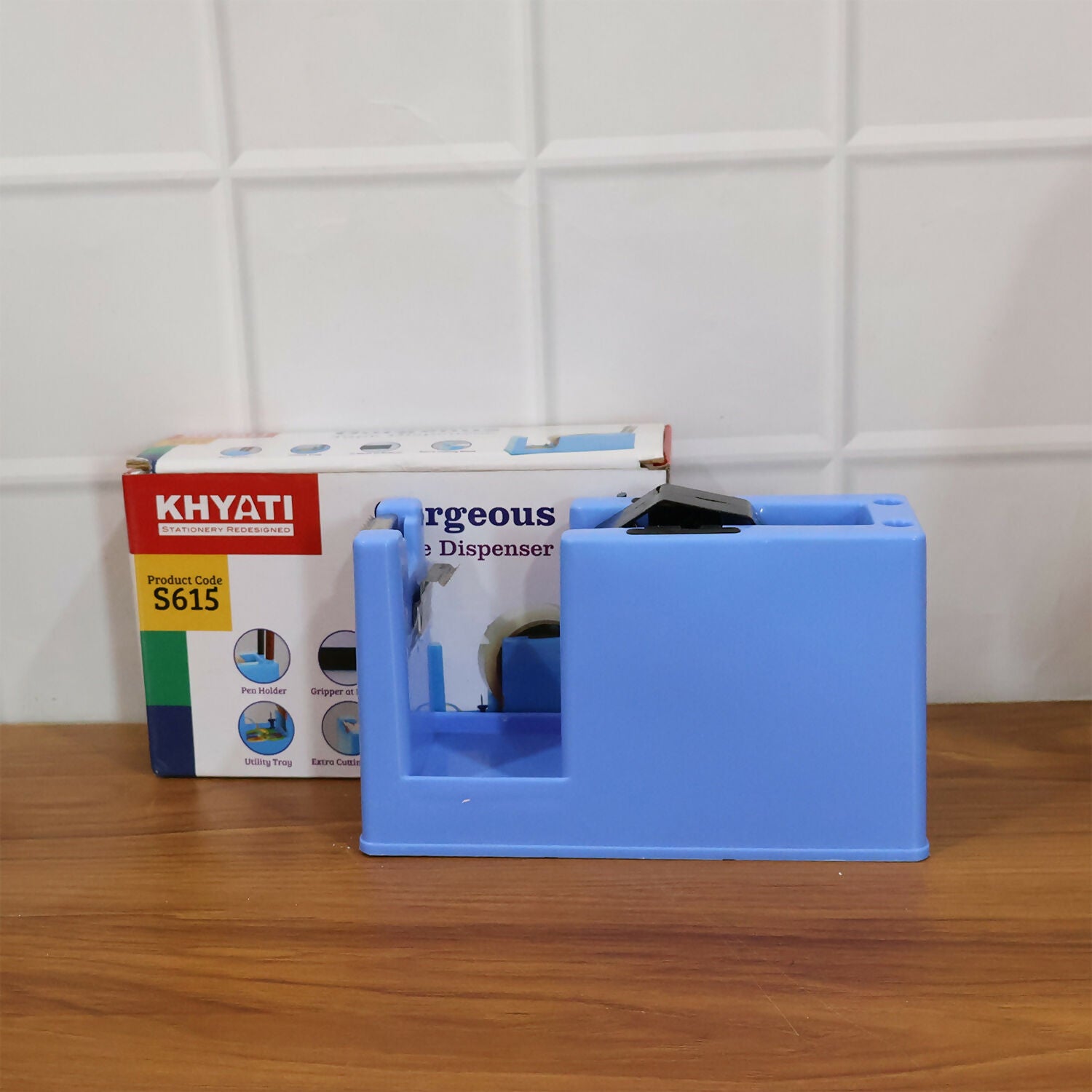 Close-up of tape dispenser with clear tape roll