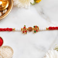 Red Pearl Designer Rakhi Golden Accents Festive Look