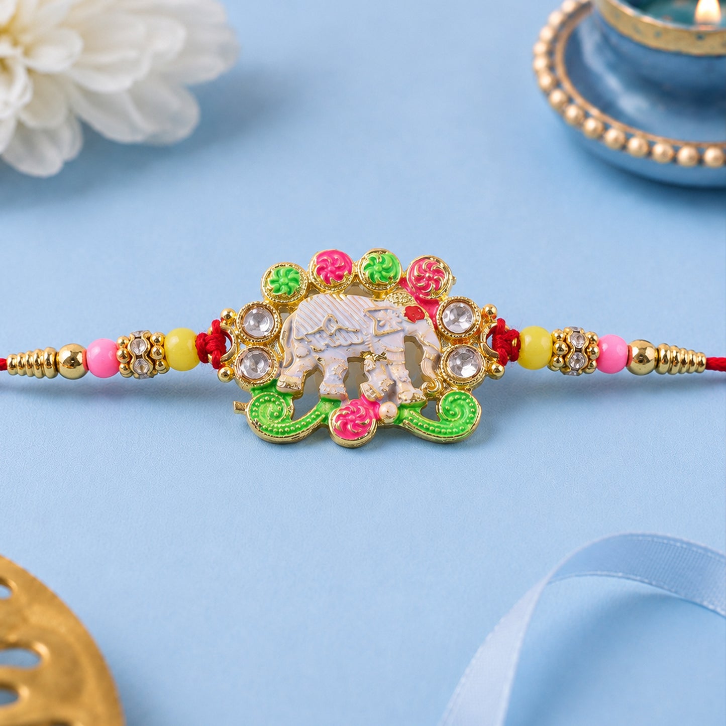 Festive Rakhi featuring Elephant Charm and gold trims in display look for Gift Use