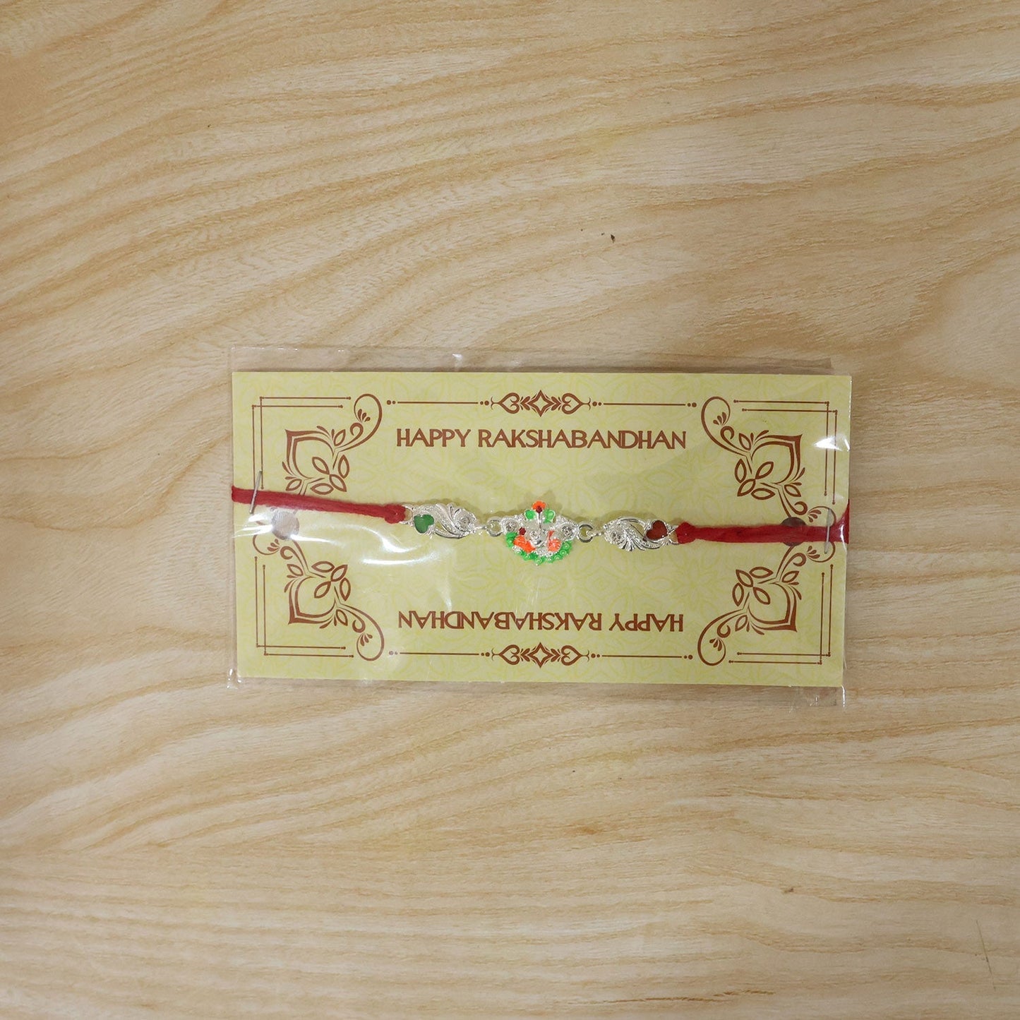 Rakhi Elegant Silver Ganesh Charm with Red Dori for Brother (10pcs)