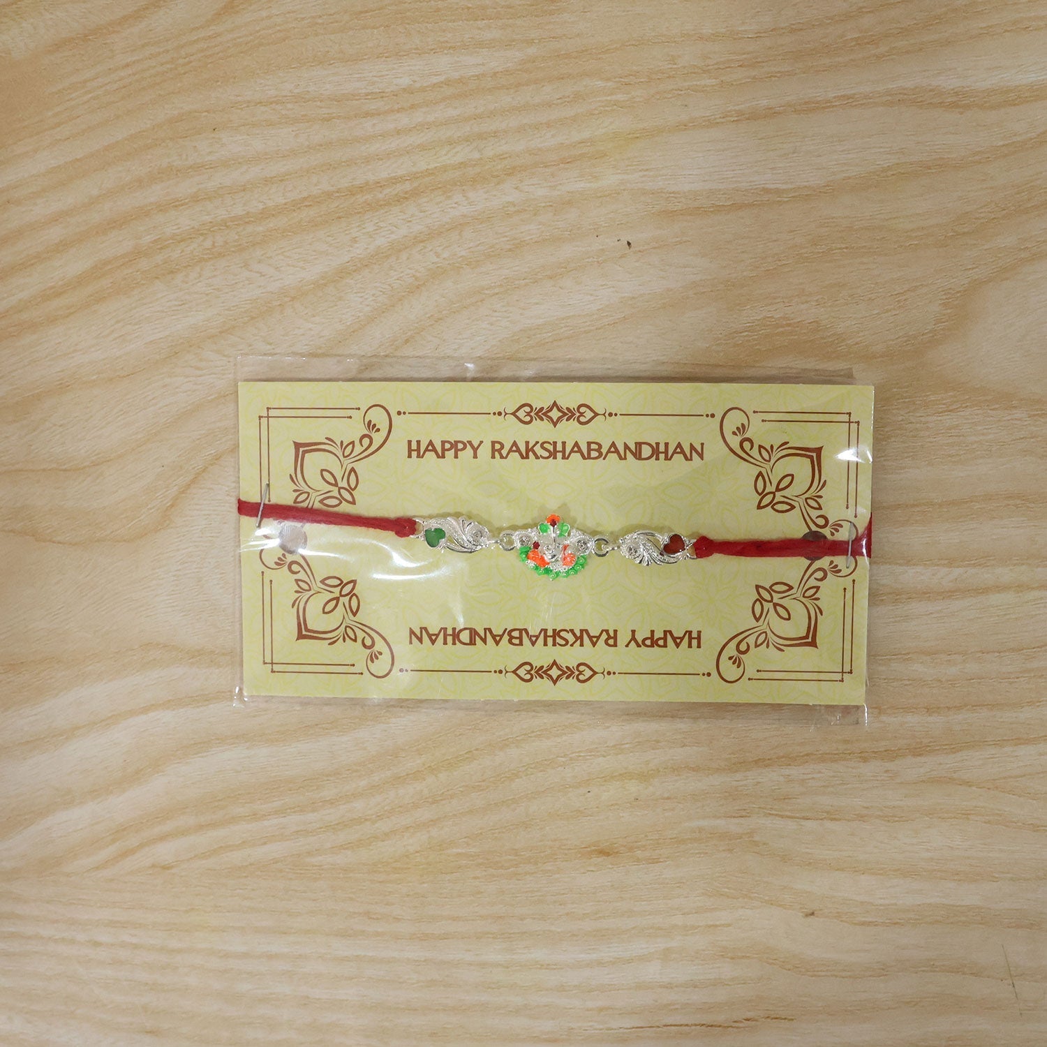 Rakhi Elegant Silver Ganesh Charm with Red Dori for Brother (10pcs)