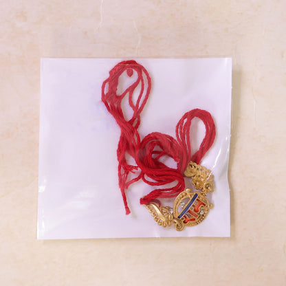 Gold-Toned Ram Rakhi with Orange-Blue Enamel, Crystal Accents & Red Thread