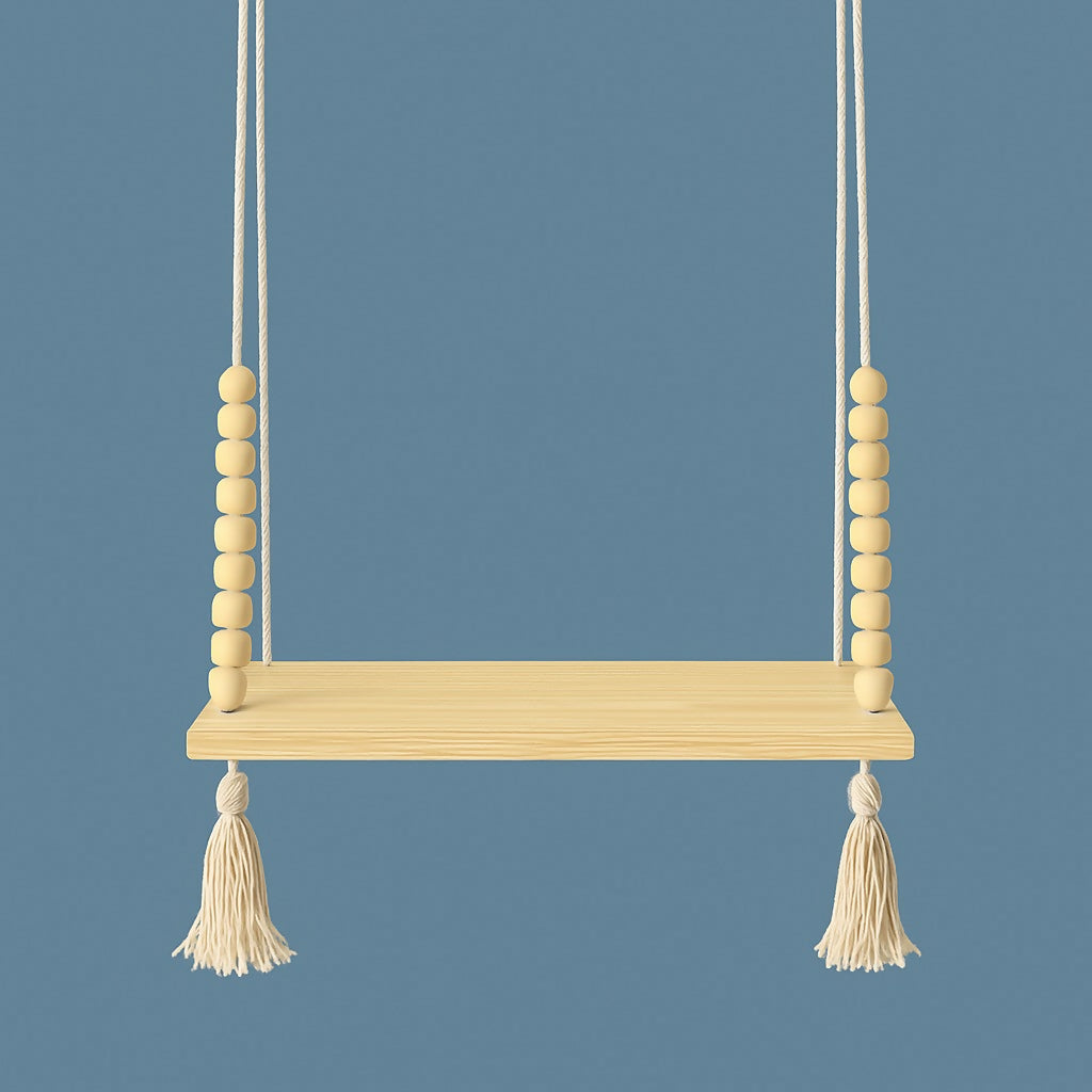 Empty light wood hanging shelf with cream beads and tassels against a solid blue background.