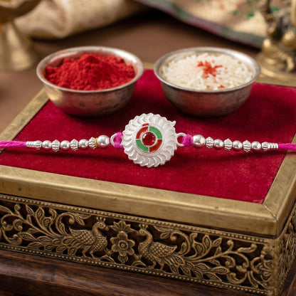 Silver Round Floral Rakhi with Red Stone and Pink Beads