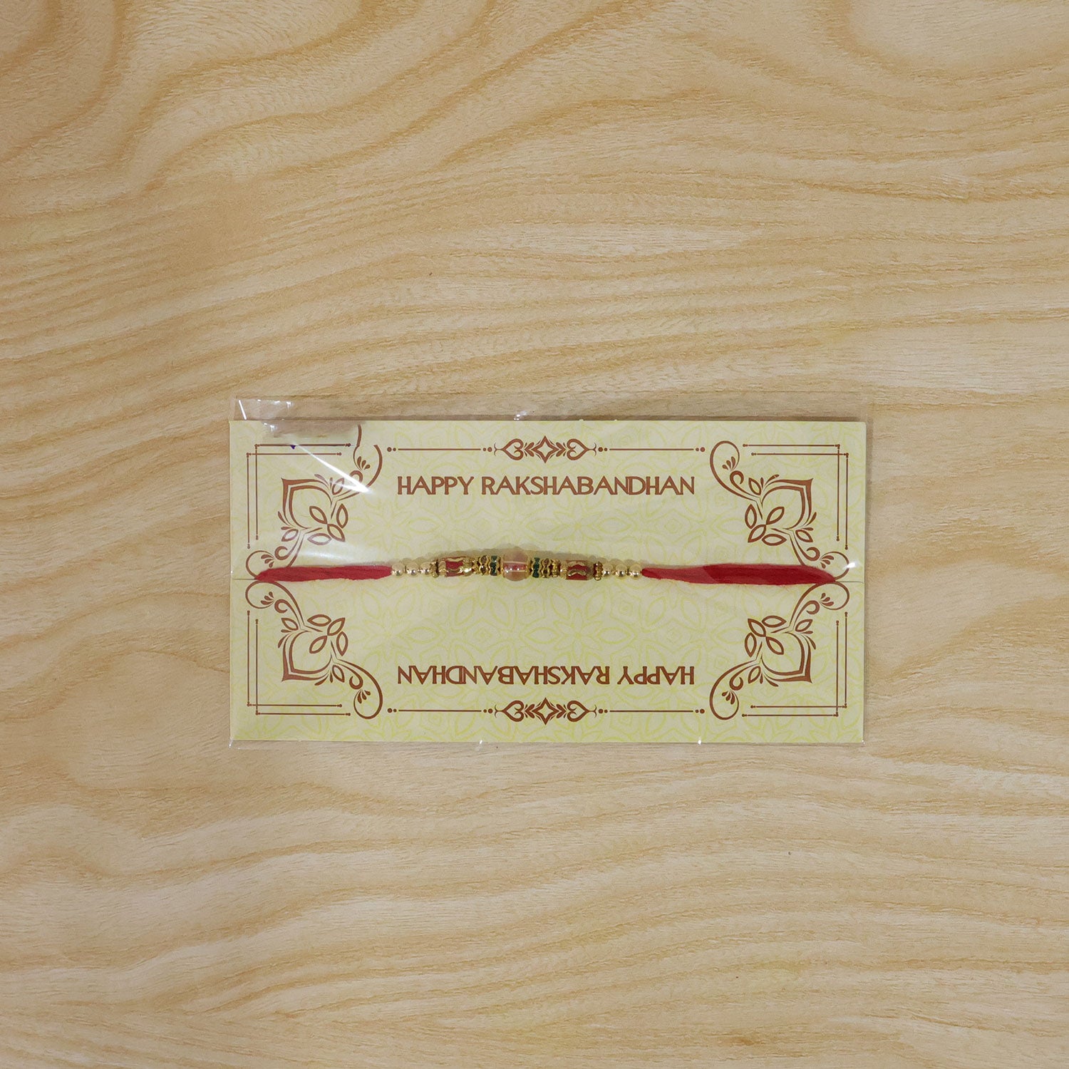 Red Green Stone Golden Designer Rakhi with Traditional Beads and Festive Thread