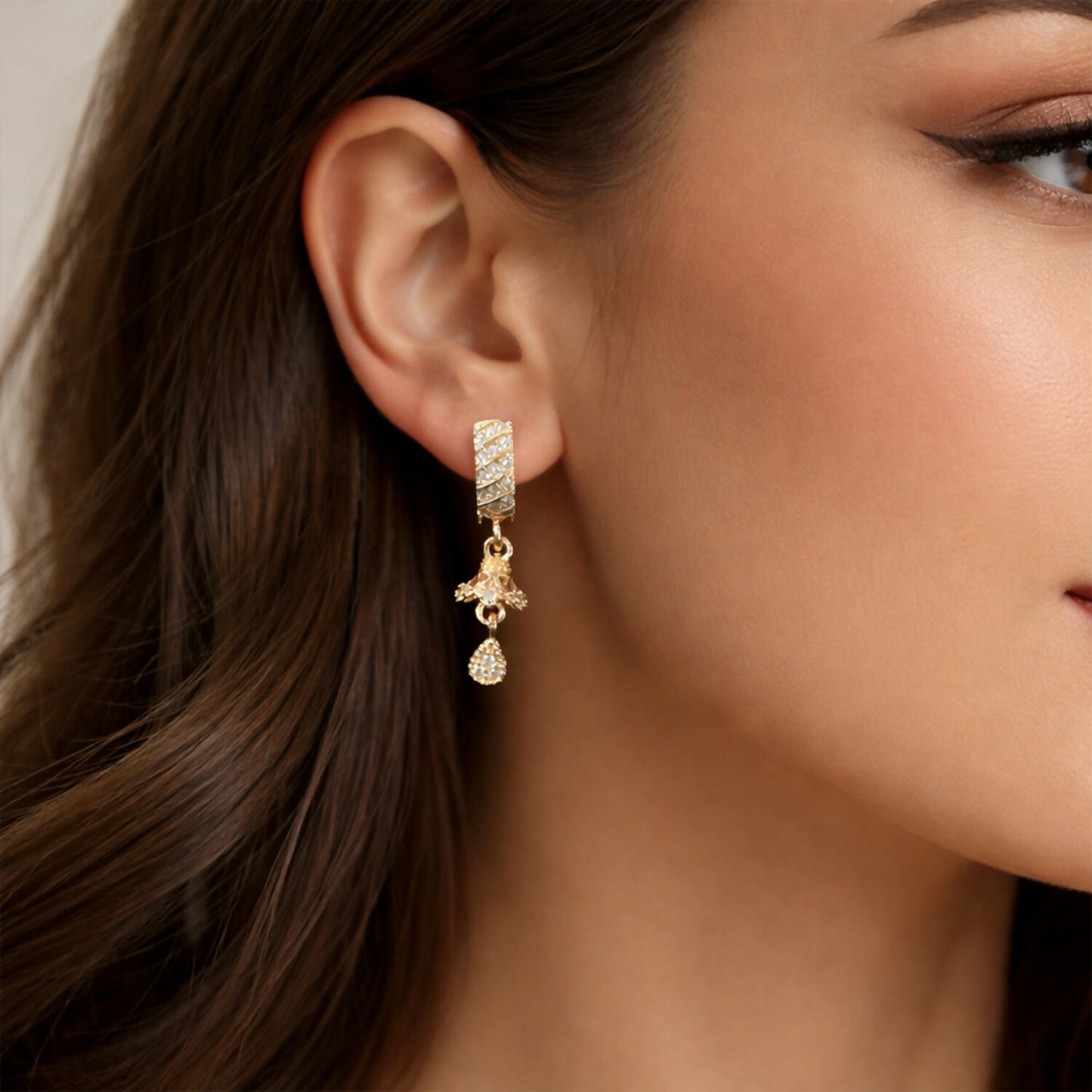 Gold-tone Spiral Bar Dangle Earrings with crystal studs on white background