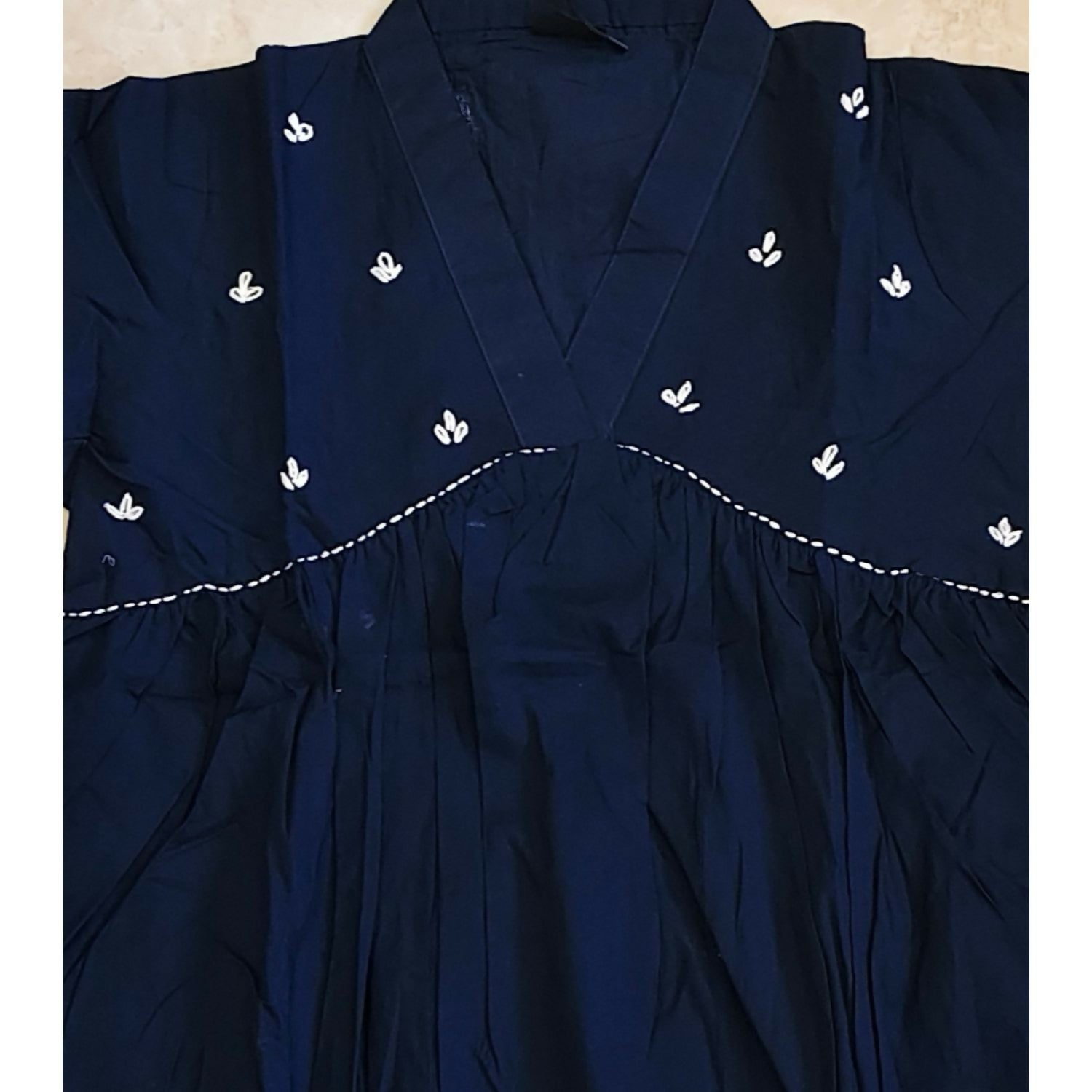 Fashionable women’s short kurti in deep blue cotton with gathered waist