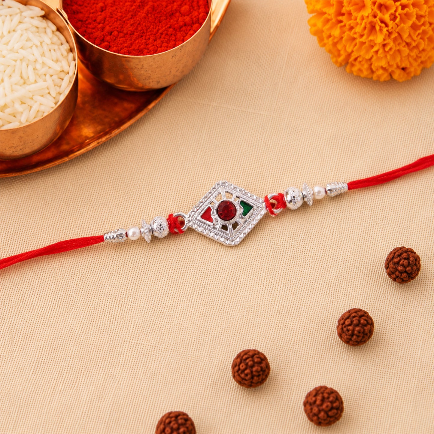 Square Silver Rakhi with Red Stone Center and Pearl Bead Chain