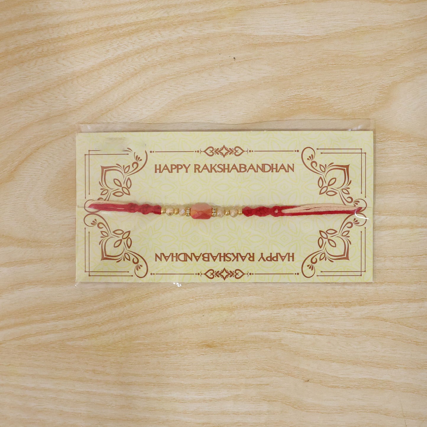 Sparkling Pearl Stone Rakhi with Colorful Thread and Premium Festive Beauty