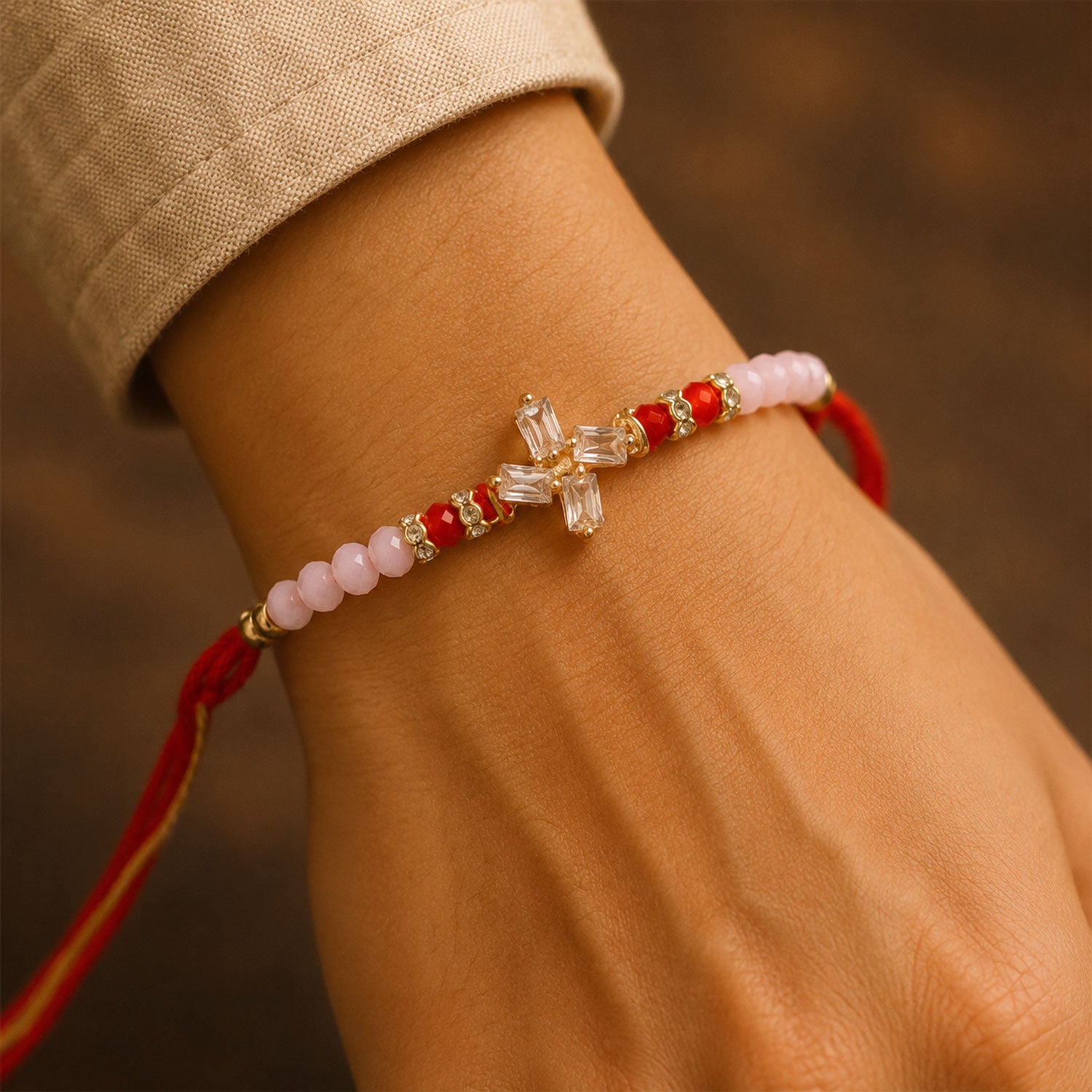 Crystal Cross Star Rakhi with Soft Pink Beads, Roli Chawal Coin and Elegant Gift Packing