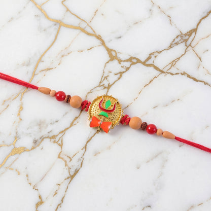 Trishul Damru Rakhi with Peach Beads and Red Thread