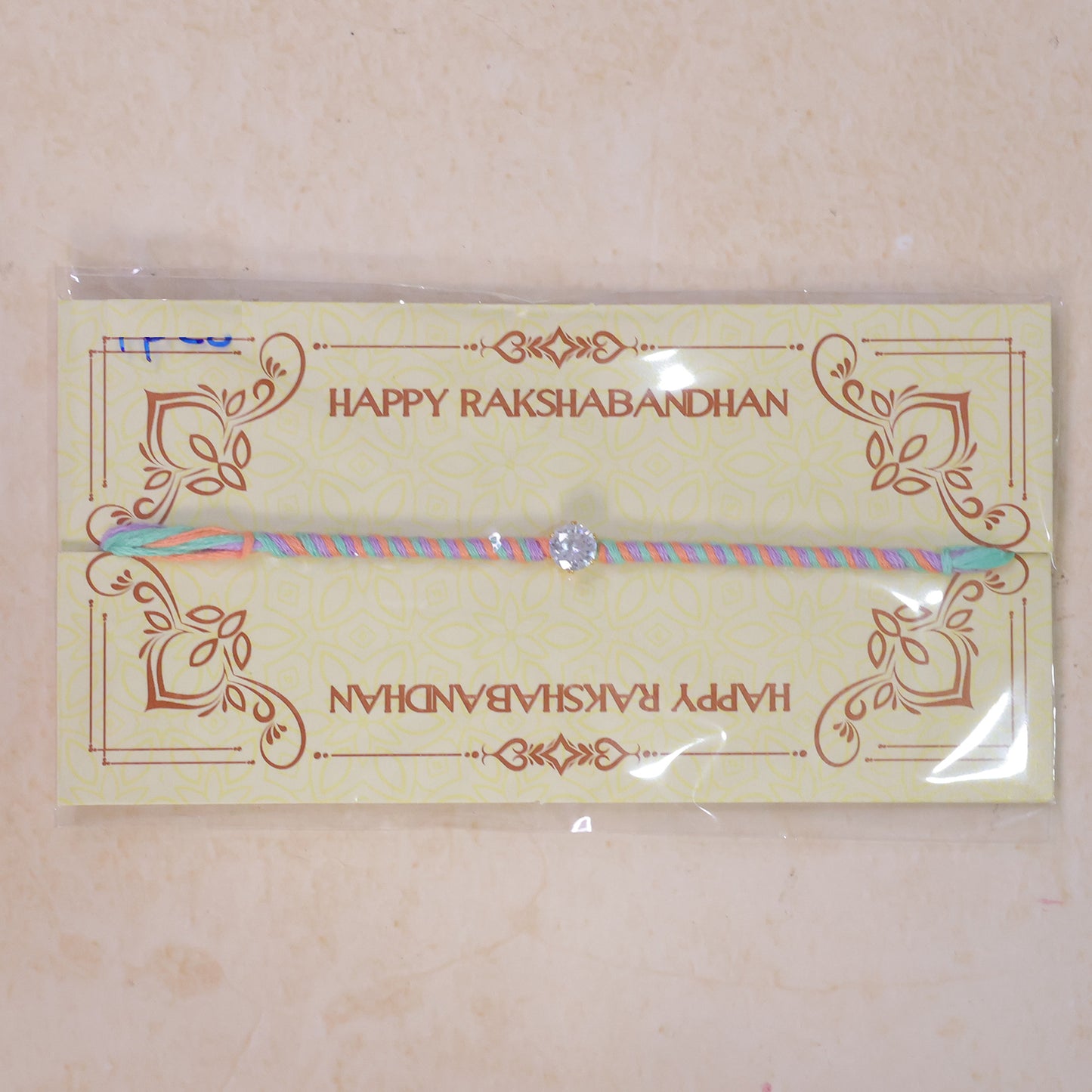 Multicolour Twisted Cord Rakhi with Sparkling Round Crystal Pendant