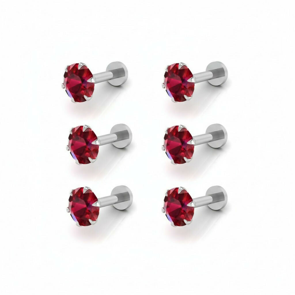 Side view of a silver-plated red crystal nosepin stud showing the flat-back design
