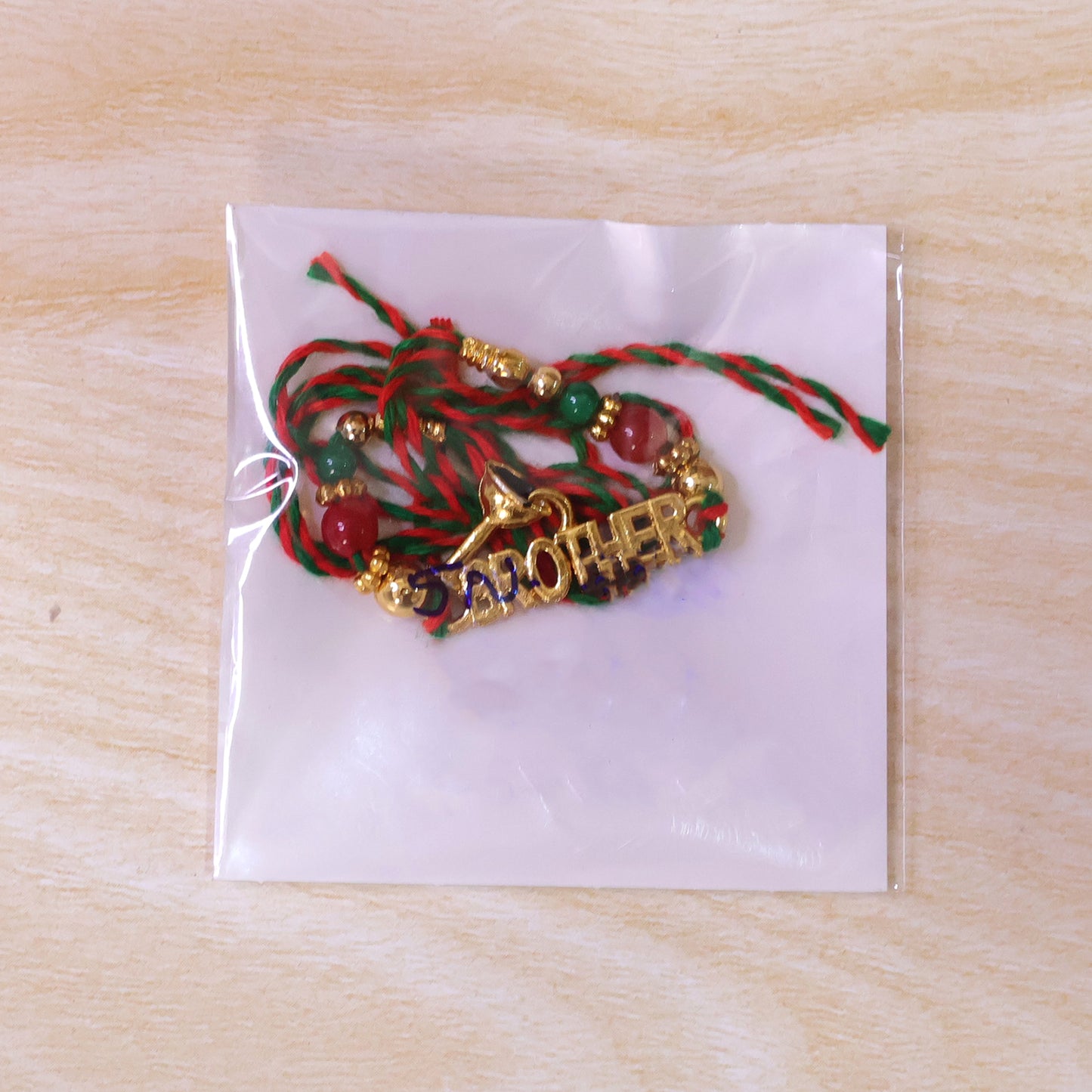 Designer Rakhi with BROTHER Text Plaque and ornate frame in wrist look for Gift Use