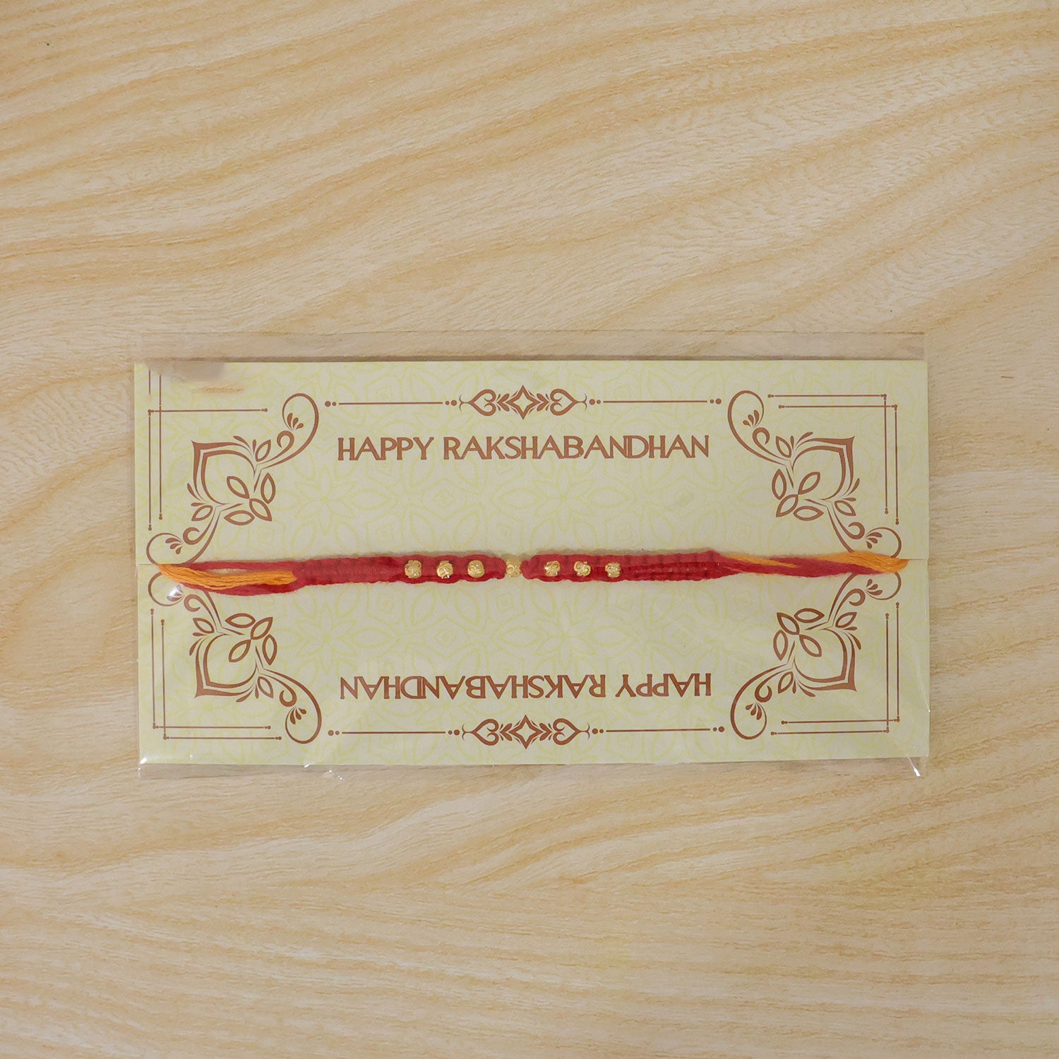 Minimal Red Stone Rakhi with Simple Beauty, Fine Beads and Festive Thread Detail