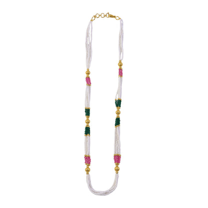 Detailed shot of pink and green beads in the traditional mala necklace