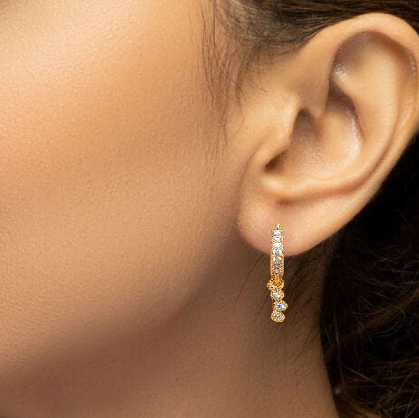 Close-up of silver heart stud earrings with sparkling cubic zirconia stones