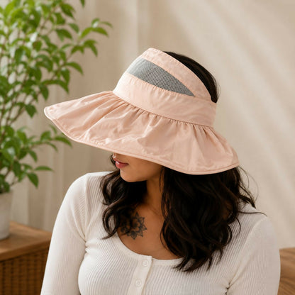 Women wearing foldable wide brim sun visor hat outdoors