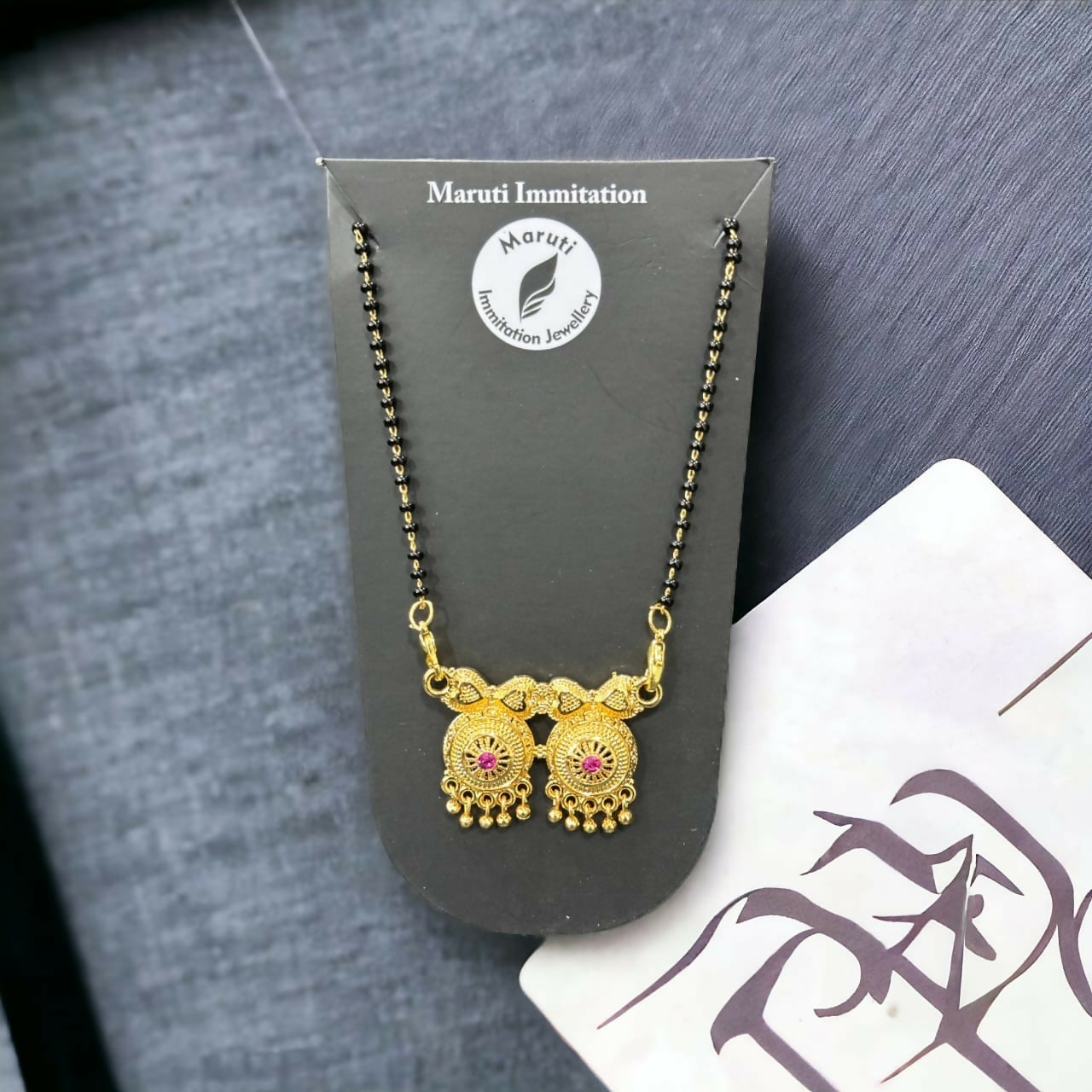 Elegant Gold-Tone Mangalsutra with Dual Pendant & Pink Stone Detailing