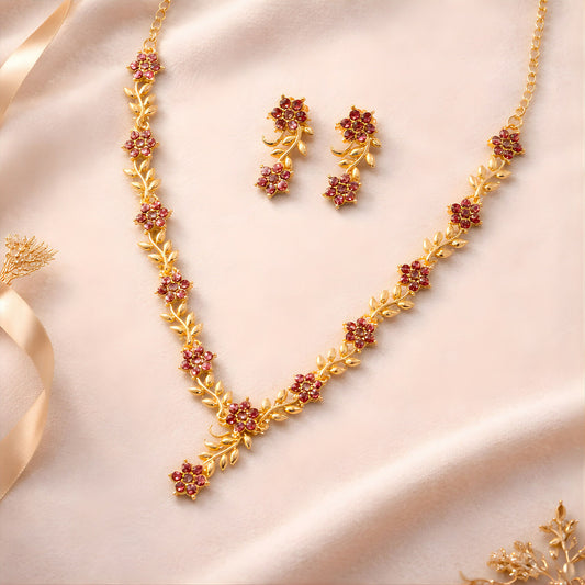Everlasting Bloom V-Necklace with Ruby Floral Design and Elegant Gold Detailing