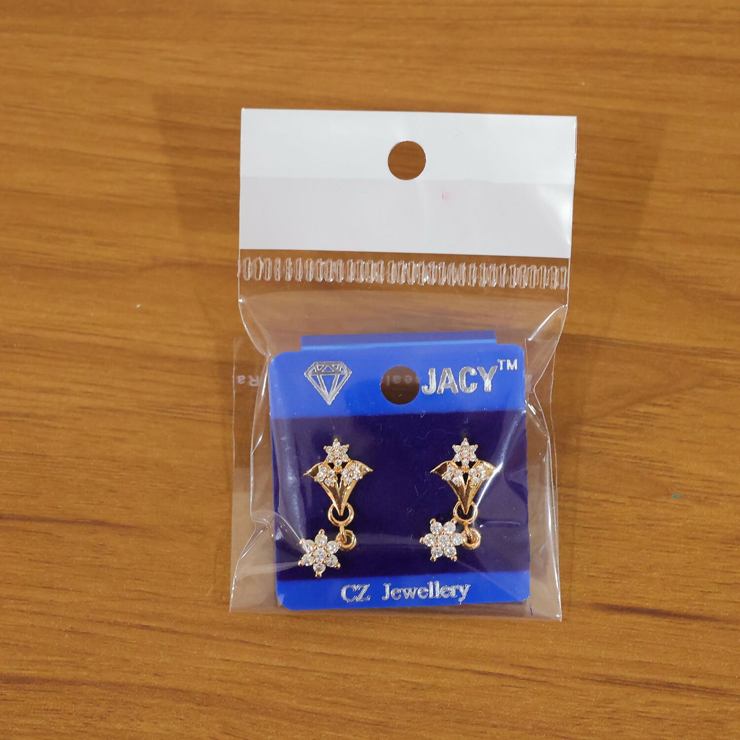 Fashion photo of rose gold floral star drop earrings sparkling bright
