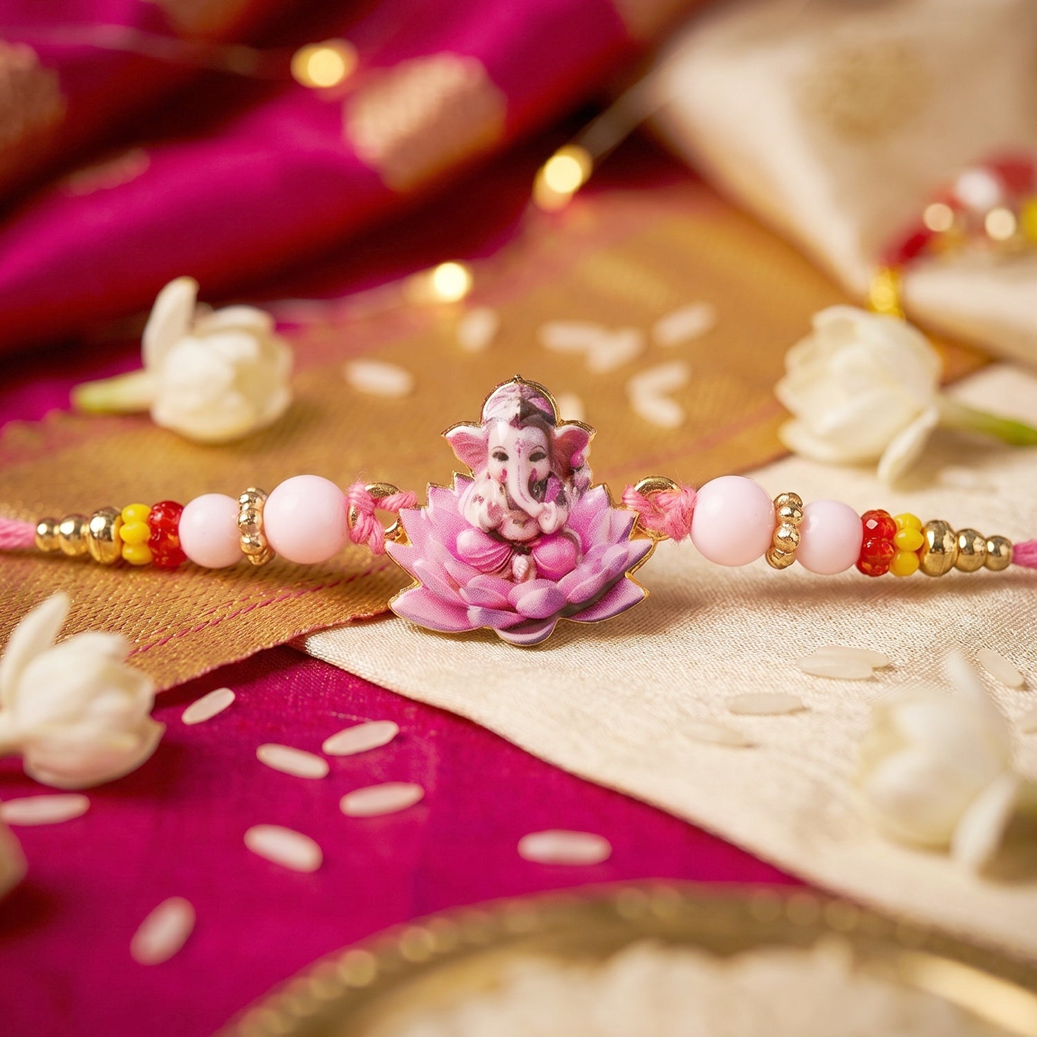 Lord Ganesha on Pink Lotus Designer Rakhi