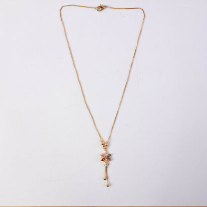 Styled look with multicolor crystal flower pendant and gold chain