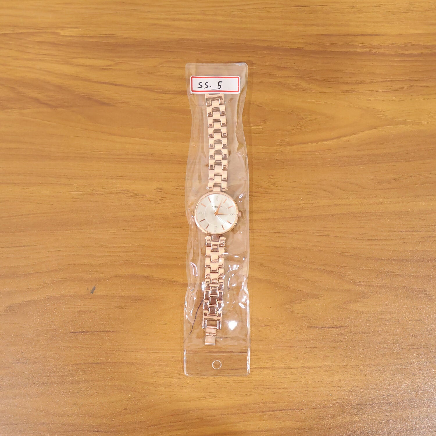 Packaging box with rose gold women's analog watch