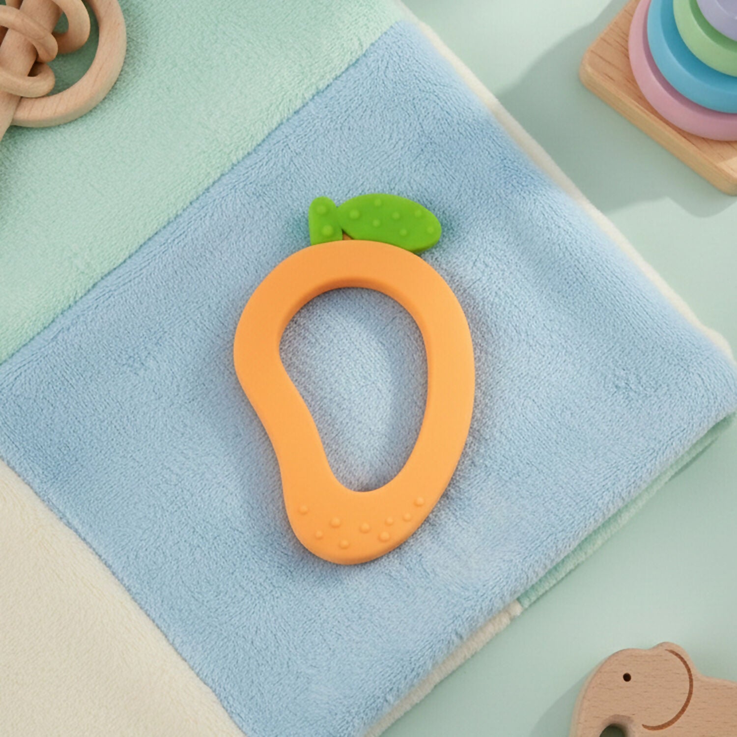 Mango-shaped silicone baby teether