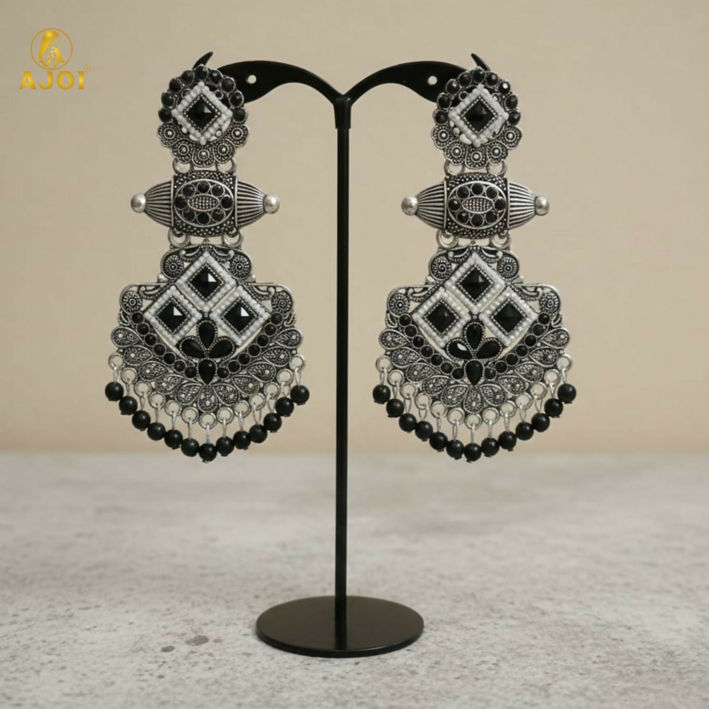 Side view of oxidized silver black stone chandbali earrings