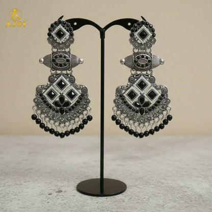 Side view of oxidized silver black stone chandbali earrings