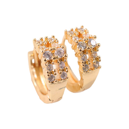 Sparkling crystal-studded gold-tone hoop earrings displayed elegantly