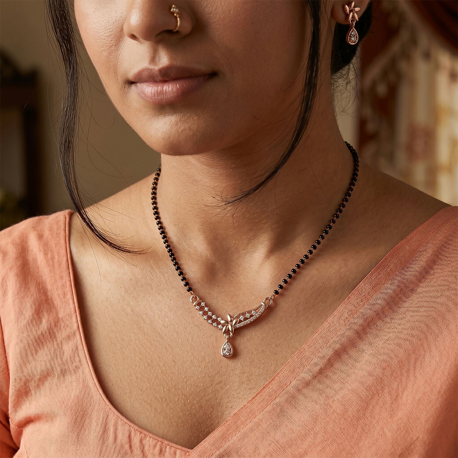 Close-up of the stylish drop pendant with embedded stones