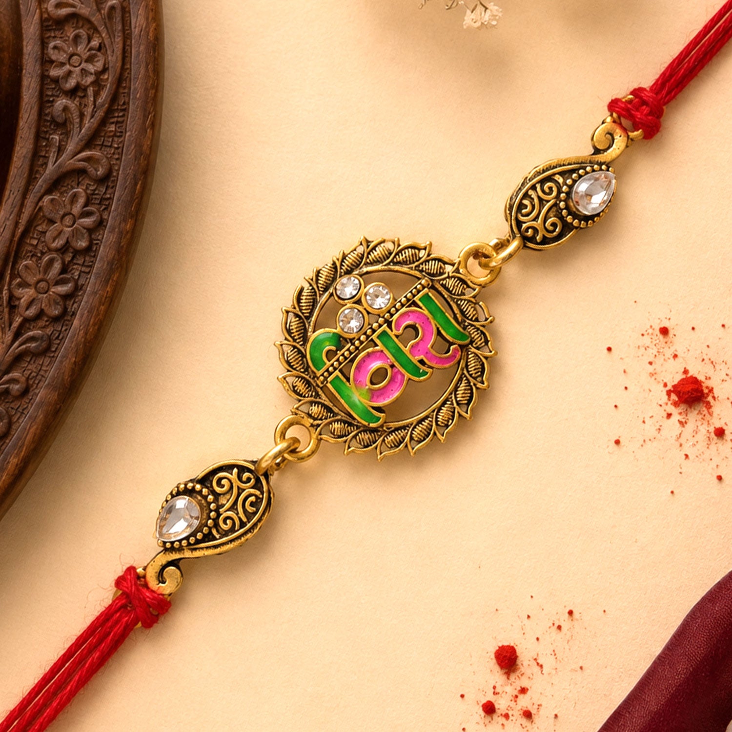Antique Gold-Toned Veera Rakhi with Pink-Green Enamel, Crystal Accents & Red Thread
