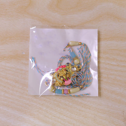 Gold Peacock Kundan Pendant Rakhi with Pastel Beads