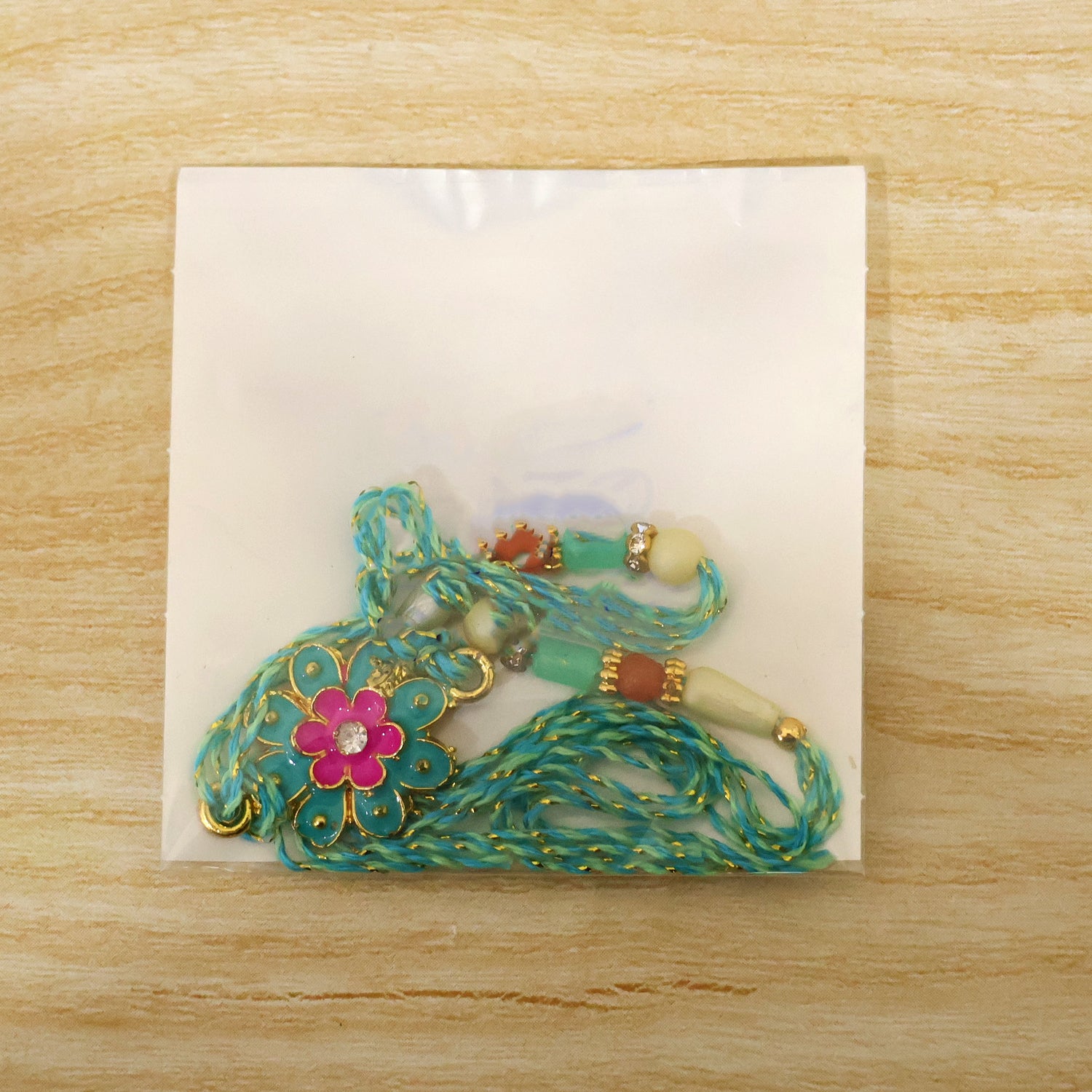 Premium Rakhi with Floral Blossom Charm and crystal accents in bead line for Gift Use
