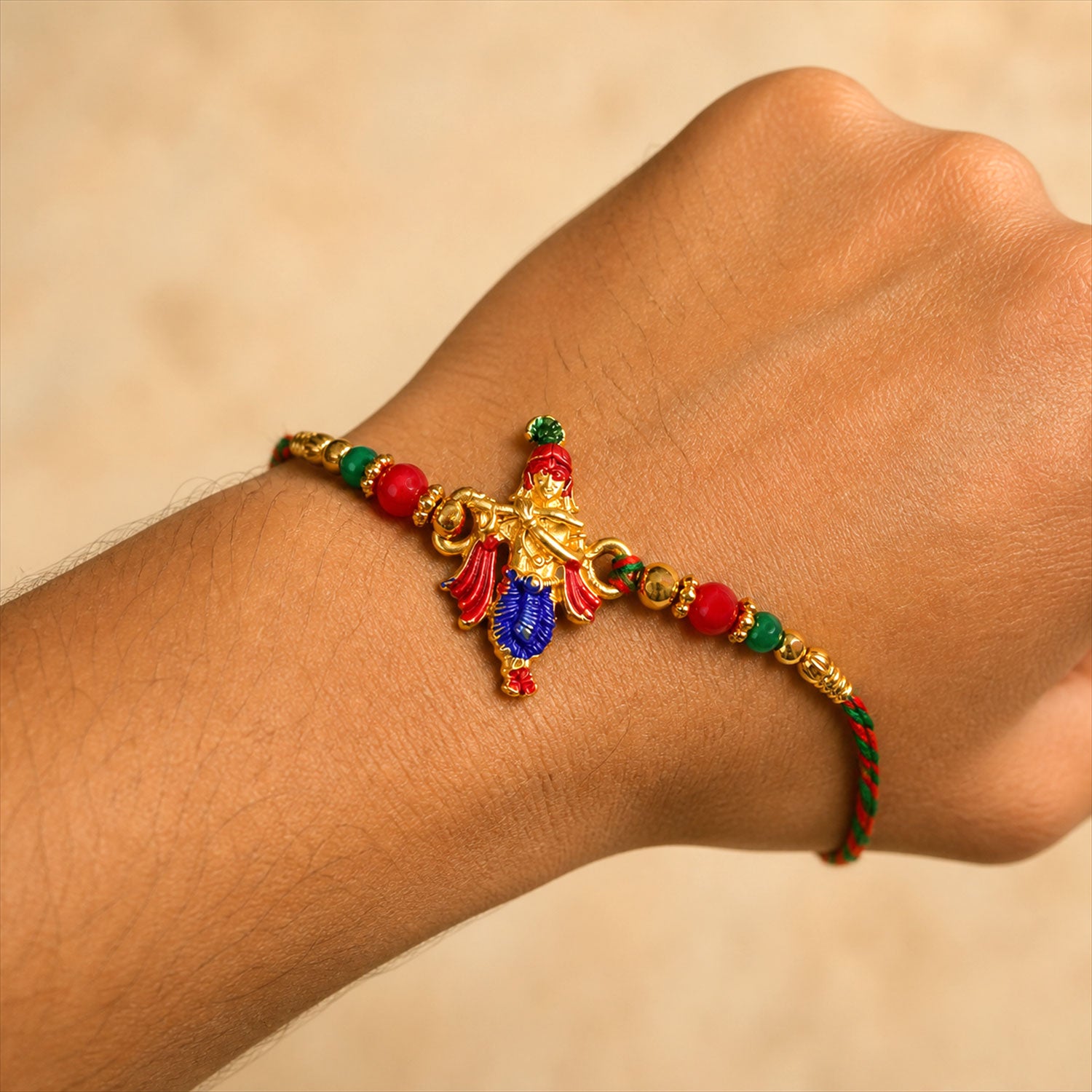 Lord Krishna Flute Pendant Rakhi with Red and Green Beads