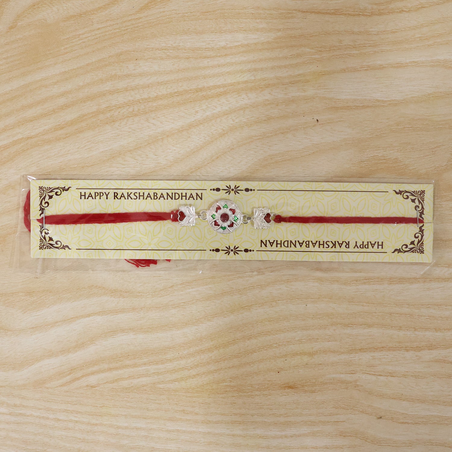 Silver Decorative Rakhi for Boys with Red and Green Accents